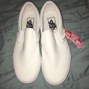 All white slip on vans